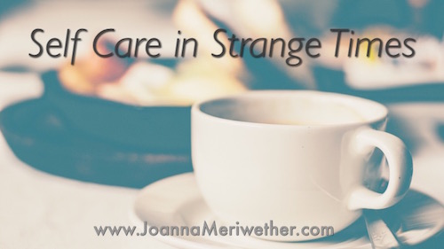 a tea cup sits in front of food on a table with the words 'self-care in strange times' positioned above the cup