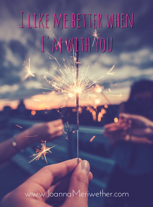Three hands holding sparkler fireworks with the words "I like me better when I'm with you" across the top